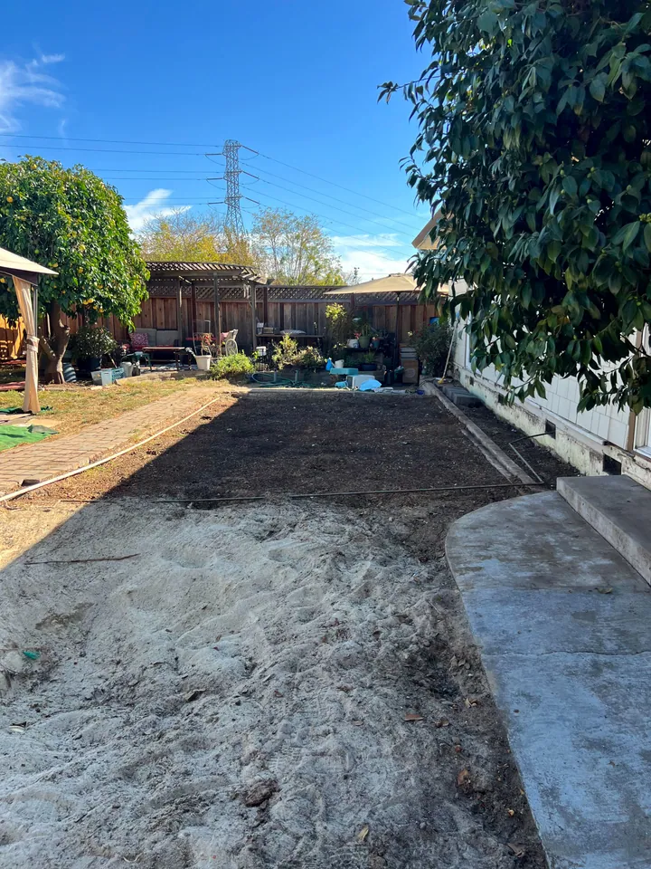 Backyard graded flat and clear where the deck and hot tub used to be